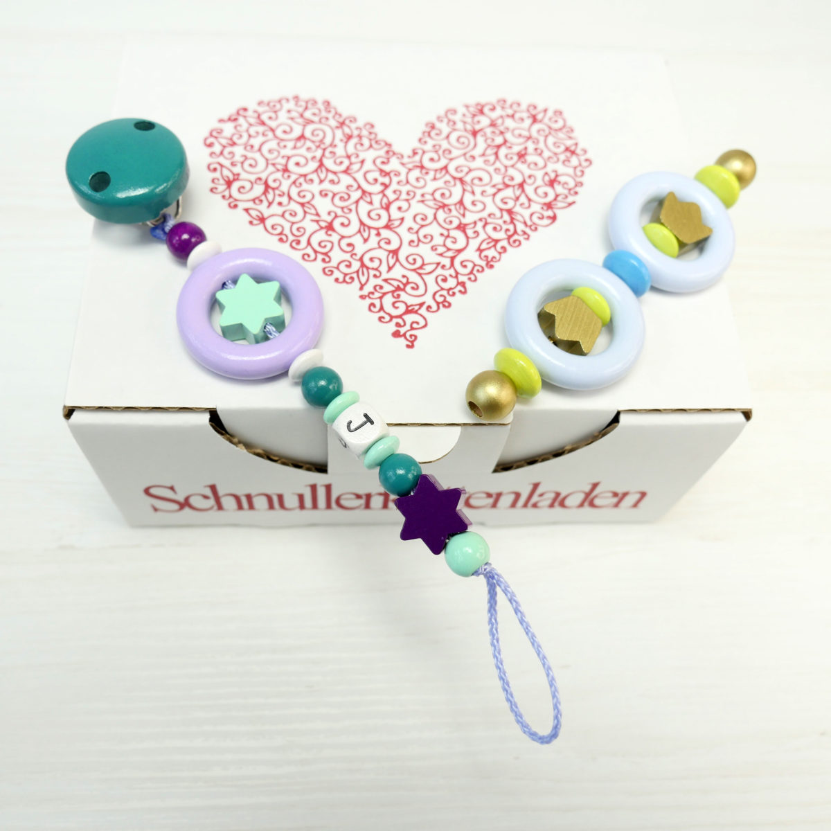 Schnullerkette und Greifling mit Mini-Ringen aus Holz